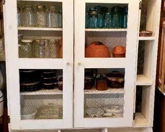 White cabinet, copper pans, blue & white canning jars etc.