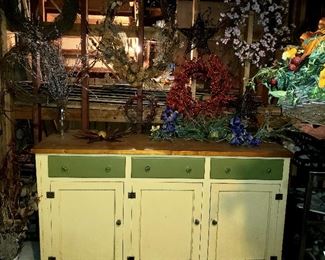 Cabinet and assorted wreaths