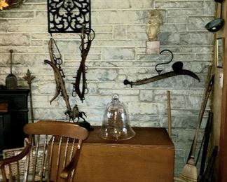 Drop leaf table, arm chair, one of three cast iron wall hanging etc.