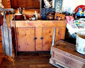 Sled, pine cabinet, pitcher, muffin tin, small chest, wooden bucket etc.