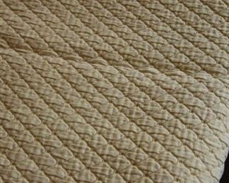 quilted tan blanket