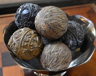 silver bowl and decorative spheres
