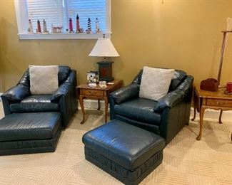 Pair of dark green leather chairs & ottomans 