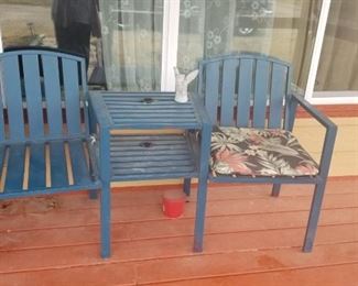 Metal seating. Two chairs and table. All in one