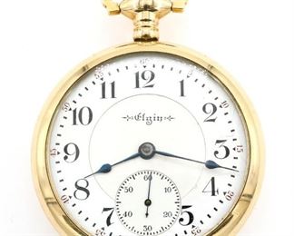 An Elgin "Veritas" Model Railroad watch.  18 size, 23 j, Adj 6 pos, DR, DMK, GJS, SW, LS, recased engraved GF, OF, Porcelain DSD with Arabic numerals marked "Elgin".  Serial #9595903.  Minor wear, dial hairlines, winds, sets and running when cataloged.  ESTIMATE $300-400