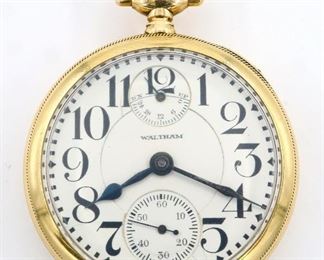 A 14 k Gold Waltham "Vanguard" Model Railroad watch with UP/DOWN wind indicator.  16 size, 23 j, Adj 5 pos, DR, DMK, GJS, SW, PS, 14 k Gold BWC Co. OF, Porcelain DSD with Arabic numerals marked "Waltham".  Serial #24604788.  95.1 grams total weight.  Some wear, monogrammed, dial hairlines, not setting properly, winds, and running when cataloged.  ESTIMATE $1,200-1,500