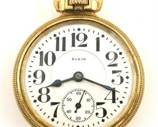 An Elgin "Father Time" Model Railroad watch.  16 size, 21 j, Adj Temp & 5 pos, DR, DMK, SW, LS, Keystone GF, OF, Porcelain DSD with Arabic numerals marked "Elgin".  Serial #24714407.  Case wear, some dents, hairline in dial, winds, sets and running when cataloged.  ESTIMATE $200-300