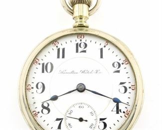 A Hamilton 940 Model Railroad watch.  18 size, 21 j, Adj Temp & 5 pos, DR, DMK, SW, LS, Hamilton Nickel display back, OF, Porcelain DSD with Arabic numerals marked "Hamilton Watch Co.".  Serial #454885.  Some wear, dial hairlines, winds, sets and running when cataloged.  ESTIMATE $200-300