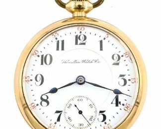 A Hamilton 940 Model Railroad watch.  18 size, 21 j, Adj Temp & 5 pos, DMK, SW, LS, Engraved Keystone GF, OF, Porcelain DSD with Arabic numerals marked "Hamilton Watch Co.".  Serial #296545.  Some wear, dial hairlines, flake at 2:00, winds, sets and running when cataloged.  ESTIMATE $200-300