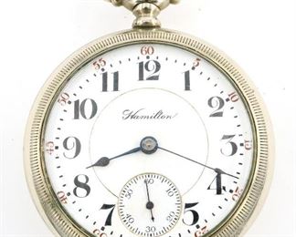 A Hamilton 940 Model Railroad watch.  18 size, 21 j, Adj Temp & 5 pos, DR, DMK, SW, LS, Defiance Nickel, OF, Porcelain DSD with Arabic numerals marked "Hamilton".  Serial #594223.  Minor wear, faint dial hairline, sets and running when cataloged.  ESTIMATE $200-300