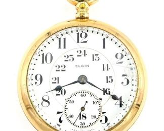 An Elgin "B. W. Raymond" Model Railroad watch.  18 size, 19 j, Adj Temp & 5 pos, DR, DMK, GJS, SW, LS, GF, OF, Porcelain 24 hr DSD with Arabic numerals marked "Elgin".  Serial #11586476.  Some wear, dial hairlines, repair at 3:00, winds, sets and running when cataloged.  ESTIMATE $200-300