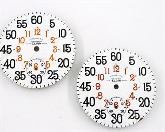 Two Ferguson pocket watch dials for 18 size Elgin watches.  Porcelain dials with Black Arabic outer numerals and Red inner marked "Ferguson Dial, Patented, For ELGIN Watch".  Stamped patent dates on back with "8102" model numbers.  Both with several hairlines, one with small flakes at "3 and 25".  ESTIMATE $400-600