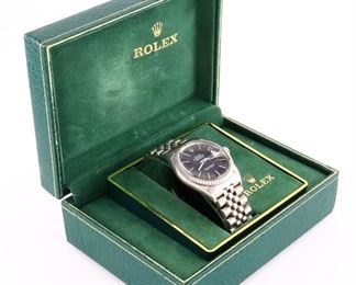 A 1980's vintage Rolex Oyster Perpetual Datejust gentleman's wristwatch.  Automatic wind movement with a Black dial, Baton markers, date aperture and sweep seconds, marked "Rolex, Oyster Perpetual Datejust, Superlative Chronometer, Officially Certified" serial number 9034839.  34 mm Stainless case and a Rolex "Jubilee" bracelet.  Some wear, winds, sets and running when cataloged.  Includes box and paperwork.  ESTIMATE $2,000-3,000