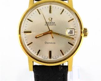 A 1970's vintage Omega gentleman's wristwatch.  24 j, calibre 565, Automatic wind movement with a Silver dial, Baton markers, date aperture and sweep seconds, marked "Omega, Automatic, Geneve" with "Omega" crystal, serial number 29414324.  35 mm Gold plated case with Stainless screw back and a leather band with "Omega" logo on buckle.  Some wear, winds, sets and running when cataloged.  ESTIMATE $400-600