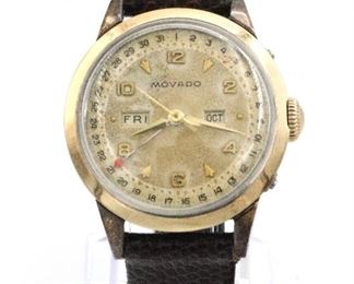 A vintage Movado Calendar gentleman's wristwatch.  17 j manual wind movement with Silvered dial, Arabic numerals, arrow markers, sweep seconds and calendar hands, month/day apertures.  33 mm Gold filled case with a replaced leather band.  Some wear, winds, sets and running when cataloged.  ESTIMATE $300-400