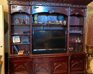 Carved wood entertainment center