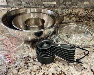 Item 182:  Lot of baking items including stainless steel bowls, Pyrex, glass bowls and measure cups:  $32