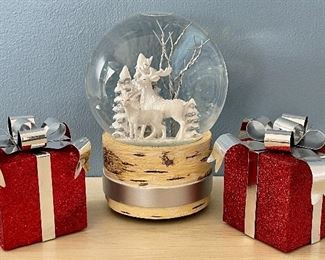 Item 224:  Lot of two presents and holiday snow globe:  $16                                                                                                        
Tallest - 7"