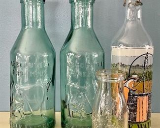 Item 372:  Lot of Vintage Bottles:  $26                                                                                (2) Absolutely Pure Milk (2 far left), Ice Water (far right), Dean Dairy (front)