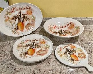 Item 265:  Ceramica Cuore "Limone" Serving Set:   $85                                                                                  pasta bowl, oval platter, (2) serving plates, cheese board/trivet