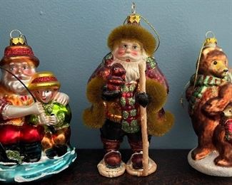 Item 490:  (2) Santa & Child Fishing Glass Ornament (far left): $28/Ea                                                                                                                    
Item 491:  (2) Santa with Snowshoes Glass Ornament (middle):  $28/Ea                                                                                                   Item 492:  "Bears"Glass Christmas Ornament (far right): $28