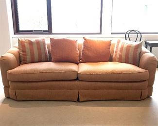 Custom rolled arm skirted sofa