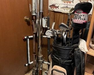 fishing poles- golf clubs large weight set- and bars-  