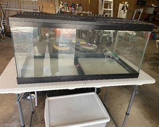 40 gallon tank for aquarium  or terrarium -w/ tons of accessories-  heat lamp- clamp   and much more 