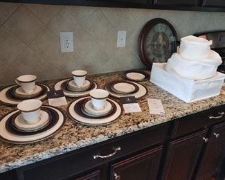 Waterford China 4 five piece place settings and protective cases