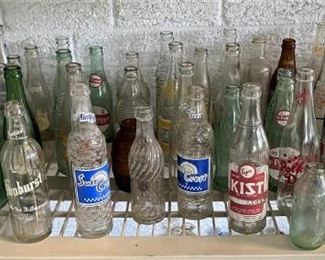 SOME OF THE VINTAGE SODA BOTTLES
