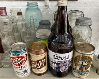 UNOPENED VINTAGE CANS AND BOTTLES.