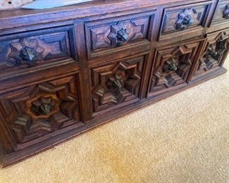 A close up of the carving front on the buffet priced to sell online in previous photo