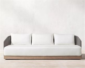 Restoration Hardware Havana sofa crafted by Louis Ho.  Teak base with outdoor weather resistant cord on the back.    Sunbrella fabric cushions.
68" Classic Sofa Overall: 68"W x 33¾"D x 26½"H
Overall Height With Cushion: 30". Retail for non-member is $2595 plus tax and shipping.  
