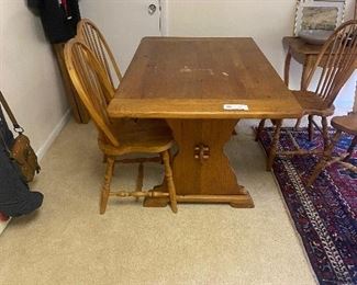 Antique trestle style dining table and four Windsor style chairs  34"w x 84"l x 28"h when two 12" leaves are inserted.  As seen is is 60"l $400 the set