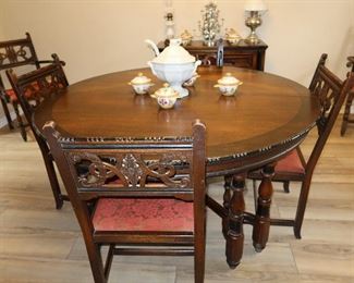 Large Antique Round Table with 7 Chairs and 6 Leaves. 60"D x 32"H. With leaves in makes 11'L table.