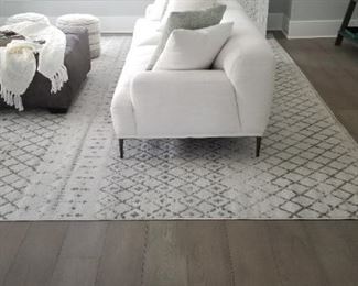 Ottoman & rug detail; couches have great style!