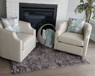 Two lovely rock & swivel reading chairs; accent rug; faux botanical. NOTE: Basket is NOT for sale