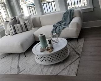 Bauhaus inspired contemporary couch by Furniture of America; Moroccan-inspired white coffee table; accent rug
