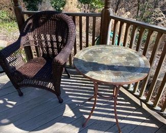 Wicker chair and tile table.