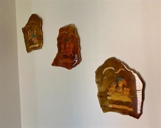 Pictures decoupaged on wood.