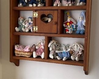 Miniatures on wood shelf.