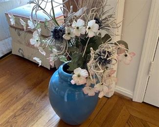 Vase with floral arrangement.