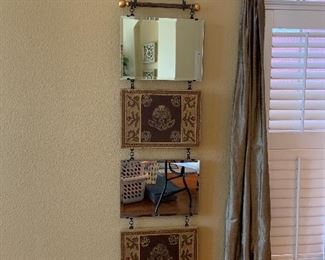 Stacking mirror art with metal candelabra 
