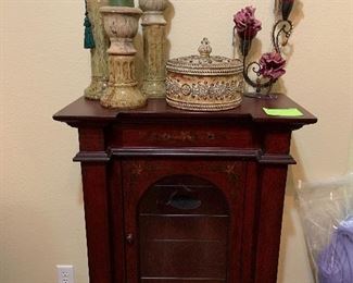 interesting painted motif curio cabinet