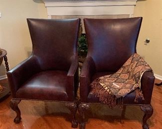 matching leather wing chairs with carved wood legs