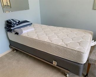 Twin bed with newer Serta Mattress and Box. 
