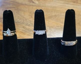 Diamond Engagement Rings- .50 carat Marquise in yellow gold, 3 stone ring totaling 1 carat in white gold, his and hers wedding bands in yellow gold