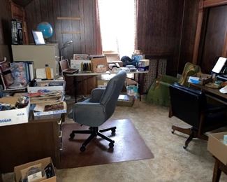Office desk, computer desk, chairs, file cabinets, records, cd's, vhs tapes, and more. Boxes of miscellaneous office items and ephemora