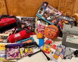 Emergency jumpstart car kit, blanket, coloring books, DVDs, books, pencils, basketball, new in box toys, file box, school supplies, curling iron, Mario backpack