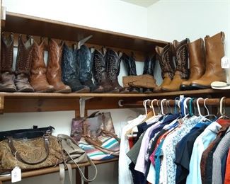 Master bedroom closet also has ladies clothing and shoes.